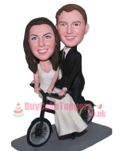 new couple ride a bike cake topper